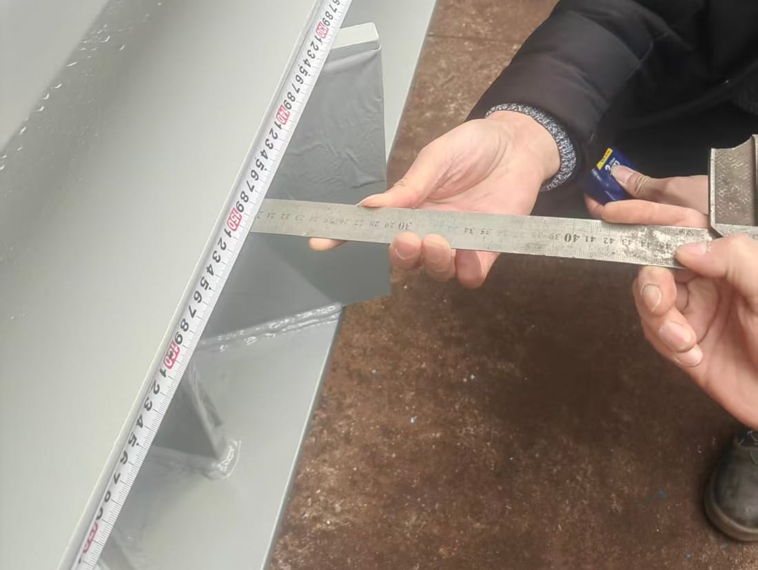Checking a fabricated steel bracket against the drawing