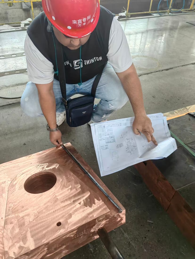 Machined copper casting checked against the engineering drawing