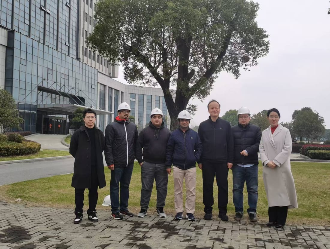Site visit team outside a manufacturer's office building